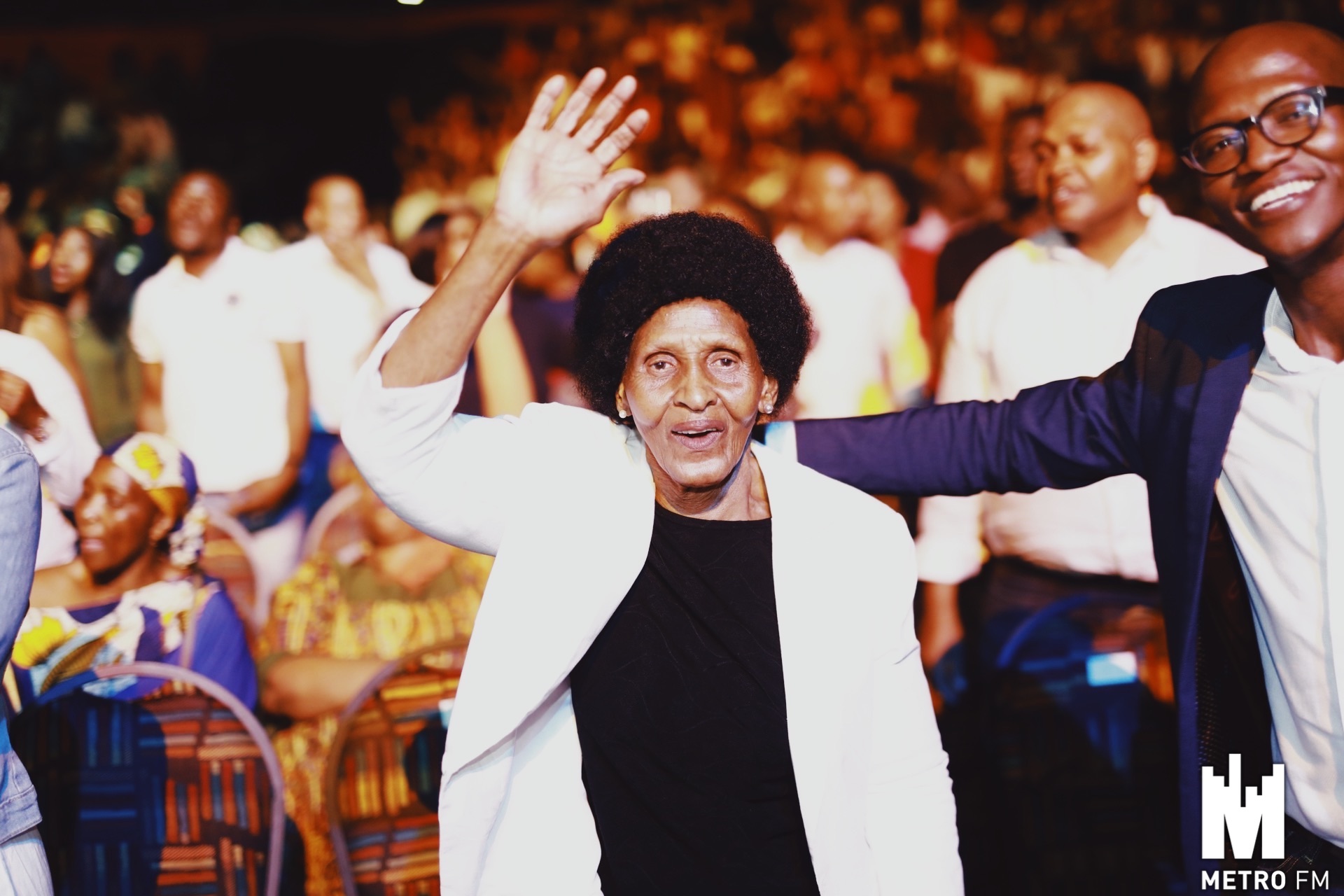 A hand raised, generations deep